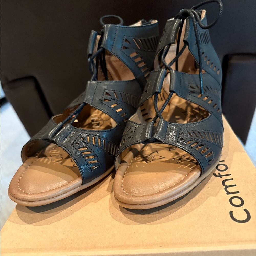 Black Gladiator Sandals with Lace-Up Design and Flat Sole
